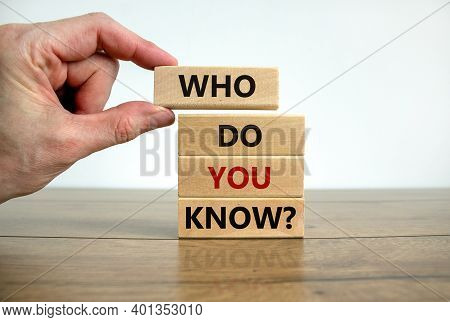 Who Do You Know Symbol. Male Hand. Wooden Blocks With Words 'who Do You Know'. Beautiful Wooden Tabl