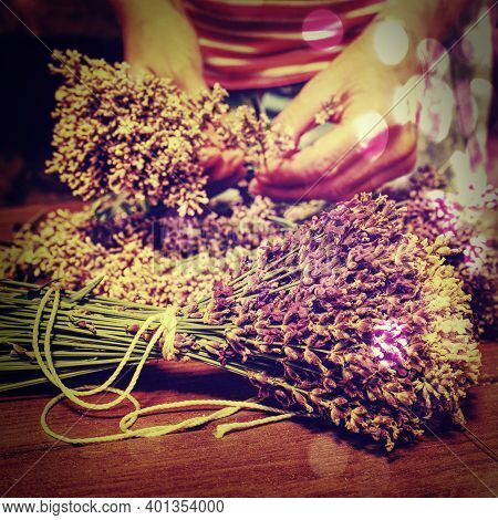 Artist Creating Lavander Bunch. Wooden Table With Lavender. Wood Tabletop With Flowers Abstract Filt