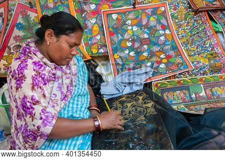 Kolkata, West Bengal, India - 31st December 2018 : Young Bengali Female Artist Painting Fishes,patta