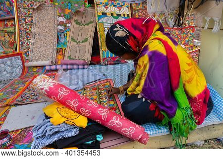 Kolkata, West Bengal, India - 31st December 2018 : Young Bengali Female Artist Painting Pattachitra 