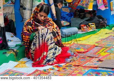 Kolkata, West Bengal, India - 31st December 2018 : Young Bengali Female Artist Painting Pattachitra 