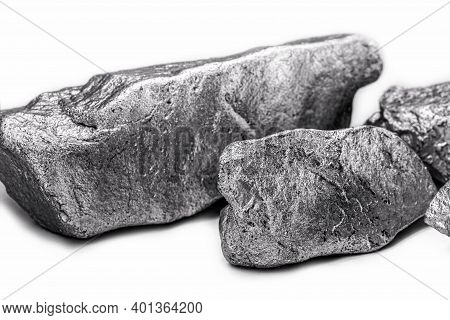 Raw Manganese. Manganese Stone Isolated On White Background. Mineral Extraction Of Heavy Metals.