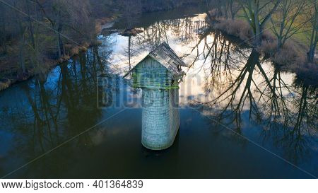 Ruin of old fishing cabin in The Radbuza River. Mysterious place with many scary stories near Chotesov in Western Bohemia. Amazing destination for beautiful holidays in Czech Republic, Central Europe.