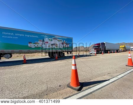 Texas Usa - February 24,2020:  A Line Of Trucks Waiting At A Usa Border Patrol Checkpoint To Be Ques