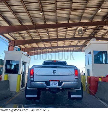 A Person In A Truck Beinging Questiond At A Usa Border Patrol Checkpoint.