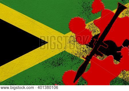 Jamaica Flag And Black Rpg-7 Rocket-propelled Grenade Launcher In Red Blood. Concept For Terror Atta