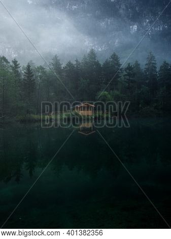 Low Clouds Fog Misty Mood Reflection Of Tree Forest Wood Cabin Boat House In Lake Bluntausee Golling
