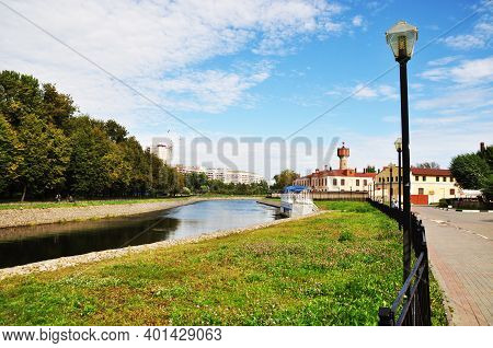 Stone River Banks. View Of The Embankment And Stone Buildings.