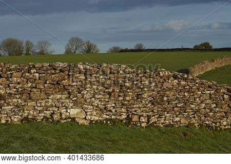 Dry Stone Walls Marking Field Boundaries In The Woolley Valley, An Area Of Outstanding Natural Beaut
