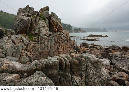 Rocky Seashore, Cloudy Weather At Sea, Coastline Of Telyakovsky Bay Primorsky Krai, Russia.