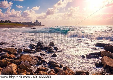 Rocky Seashore At Sunset. View Of Bat Yam City From Tel Aviv - Jafo, Israel.