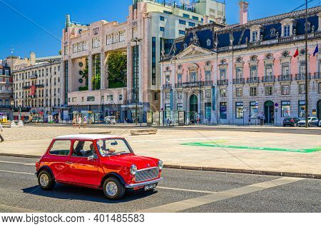 Lisbon, Portugal, June 15, 2017: Red Color Retro Vintage Car Riding In Restauradores Square Praca Wi