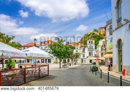 Leiria, Portugal, June 22, 2017: Praca Rodrigues Lobo Square With Typical Traditional Buildings, Hou