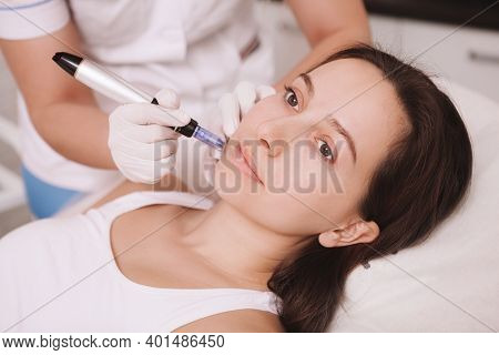 Close Up Of A Young Attractive Woman Getting Mesotherapy Treatment At Beauty Salon