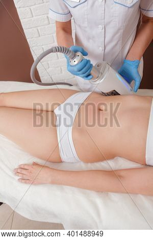 Vertical Shot Of A Woman Getting Slimming Treatment At Cosmetology Clinic, Beautician Using Endosphe