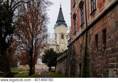 Baroque Church Of All Saints In Winter Day, Chapel Near Castle, Libochovice, Litomerice District, Bo