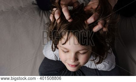 Mom Gives Head Massage To Daughter At Home Top View