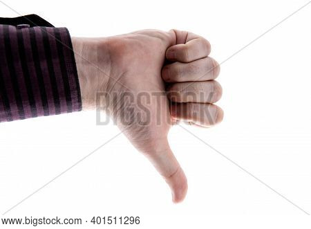 Human Hand Shows Dislike Sign On A White Background