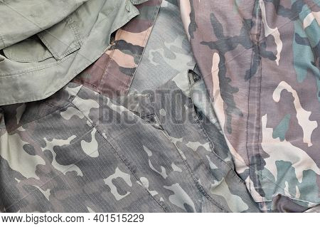 Camouflage Background Texture As Backdrop For Military Service Design Projects. Back Side Of Conscri
