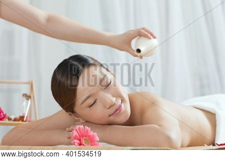 A Young Woman Enjoy Massage High Quality Photo