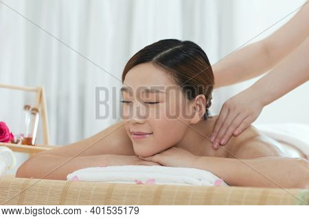 A Young Woman Enjoy Massage High Quality Photo
