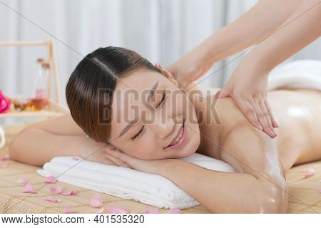 A Young Woman Enjoy Massage High Quality Photo