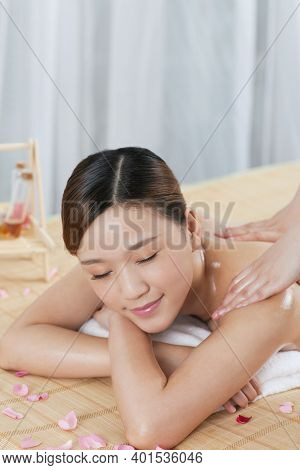 A Young Woman Enjoy Massage High Quality Photo