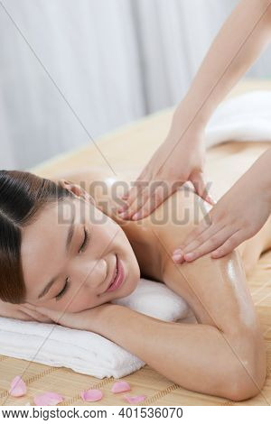 A Young Woman Enjoy Massage High Quality Photo