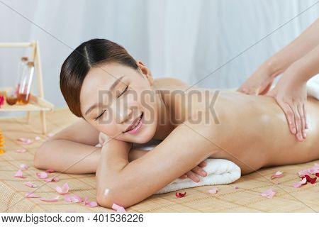 A Young Woman Enjoy Massage High Quality Photo