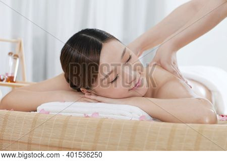 A Young Woman Enjoy Massage High Quality Photo