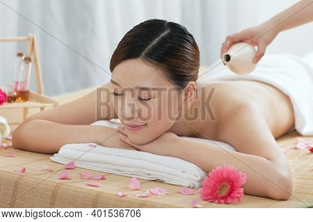A Young Woman Enjoy Massage High Quality Photo