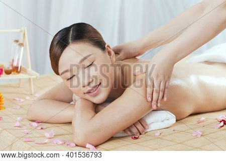 A Young Woman Enjoy Massage High Quality Photo