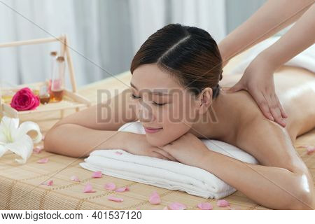 A Young Woman Enjoy Massage High Quality Photo