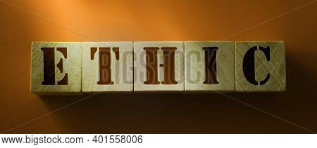 Ethic Word On Wooden Cubes On Red Background. Codex Of Ethics And Morel Concept