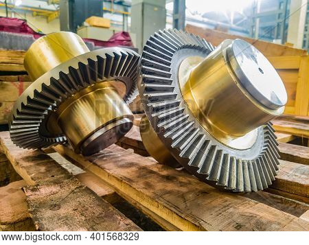 Bevel Gears With A Bronze Insert On A Mandrel After Fabrication On Gear Cutting Equipment.