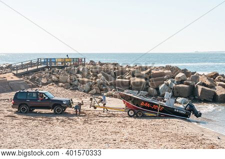 Swakopmund, Namibia - June 20, 2012: A Fishing Boat Being Loaded On A Trailer At The Molen In Swakop