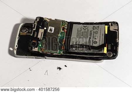 Chelyabinsk, Chelyabinsk Region, Russia - December 19.2020: Broken Phone. Shards Of The Phone. The S