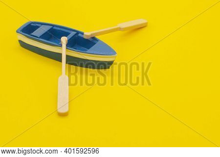 One Blue Toy Boat. Small Boat Models With Oars