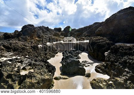 Rugged Volcanic Lava Rock Formation On Boca Ketu In Aruba.