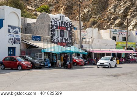 Santorini, Greece - September 19, 2020: Street With Shops In Athinios Ferry Port In Santorini. Cycla
