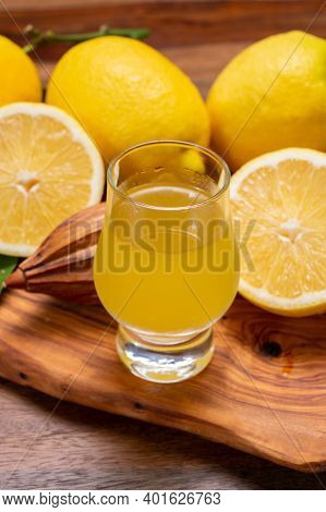 Ice Cold Sweet Limoncello Liqueur Made From New Harvest Of Fresh Ripe Yellow Italian Lemons, Amalfi