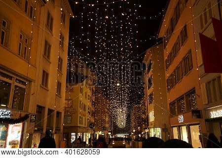 Christmas Shopping Under Traditional Christmas Lights Lucy In Side Street Rennweg In Zurich. Pedestr