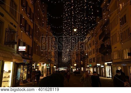 Christmas Shopping Under Traditional Christmas Lights Lucy In Side Street Rennweg In Zurich. Pedestr