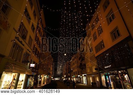 Christmas Shopping Under Traditional Christmas Lights Lucy In Side Street Rennweg In Zurich. Pedestr