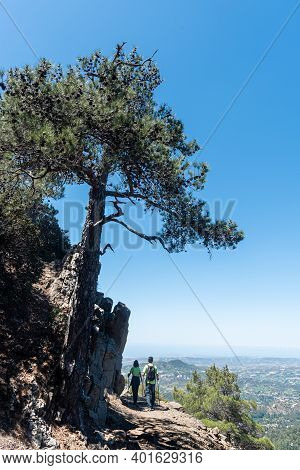 Unrecognize People Trekking On A Hikking Path At The Edge Of The Cliff In Summer. Troodos Mountains 