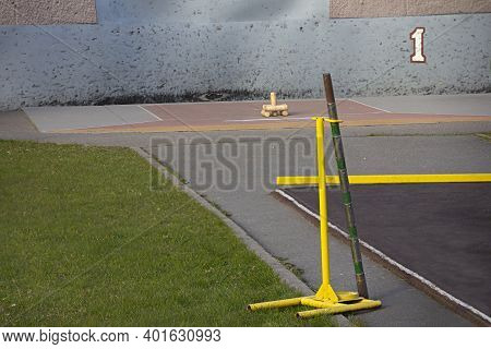 Gorodki (literally Little Cities Or Townlets) - A Russian Folk Sport Game. A Bat In A Special Holder