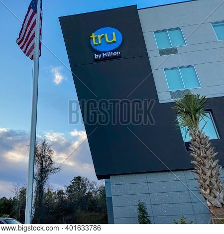 The Exterior Of A Tru Hotel By Hilton Located In Mobile, Alabama.