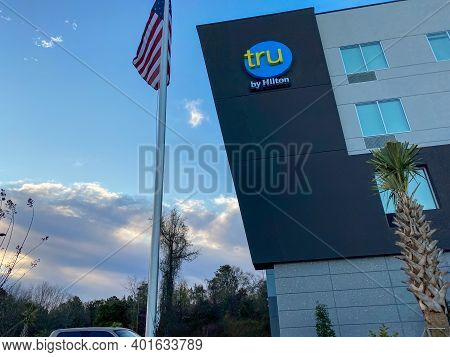 The Exterior Of A Tru Hotel By Hilton Located In Mobile, Alabama.