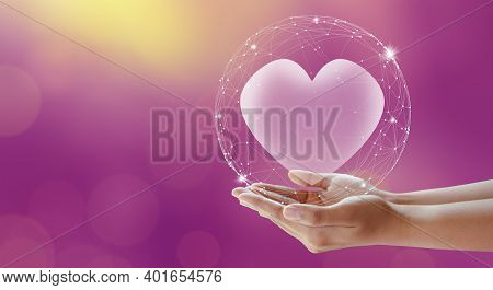 Woman Hands Giving Heart. Pink Background. Love And Valentine Concept.
