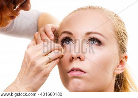 Two Women, Face Painting. Makeup Artist Applying Make Up To Model Face. Cosmetic Beauty Procedures, 